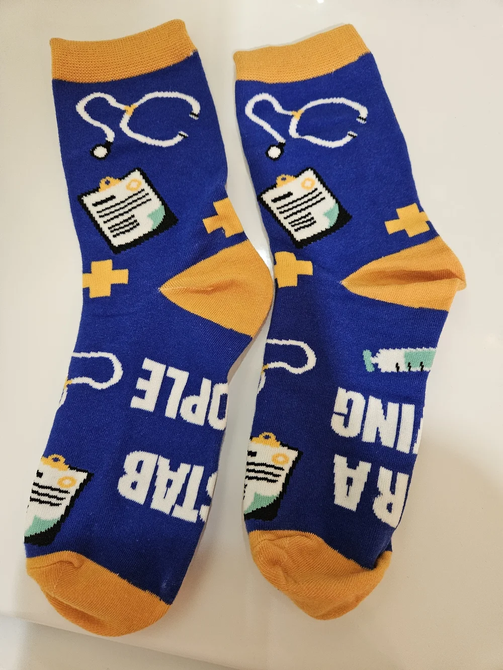 Novelty 'I Stab People For A Living' Blue & Orange Crew Socks